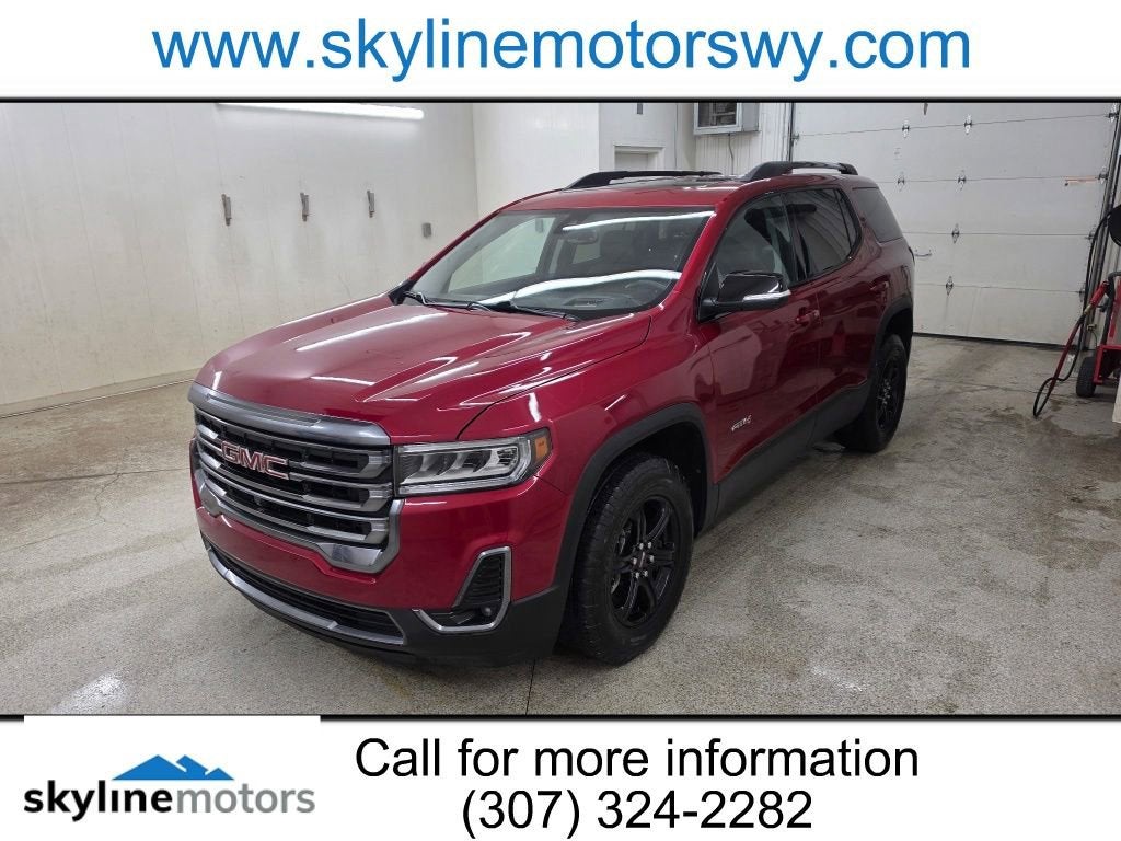 2023 GMC Acadia AT4 in Volcanic Red Tintcoat — front three-quarter view